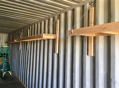 shelves suspended by steel cable for conx box|shipping container shelving rack.